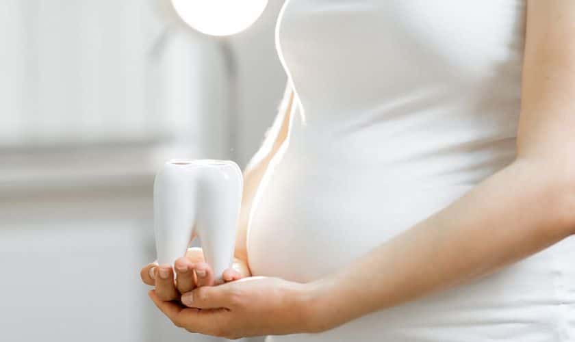 Pregnant woman practising good oral health during pregnancy